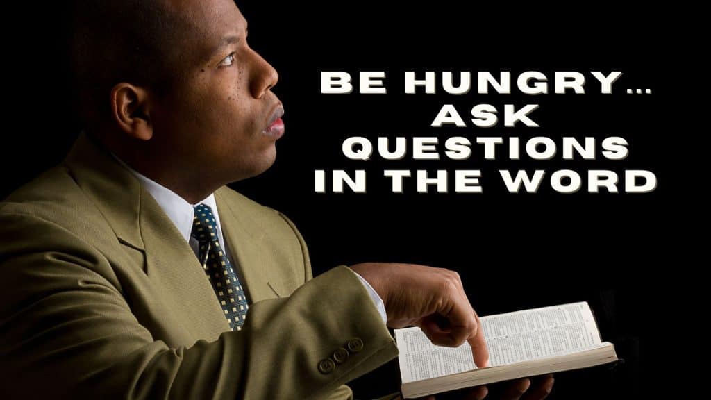 man pointing at page in Bible and looking up inquiringly to God