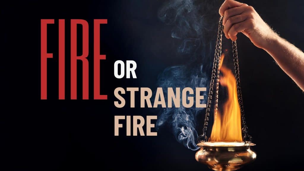 ancient Hebrew censer, burning incense, hanging from a man's hand