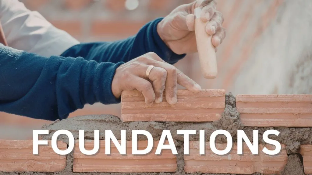 Closeup of hands of a bricklayer laying a brick